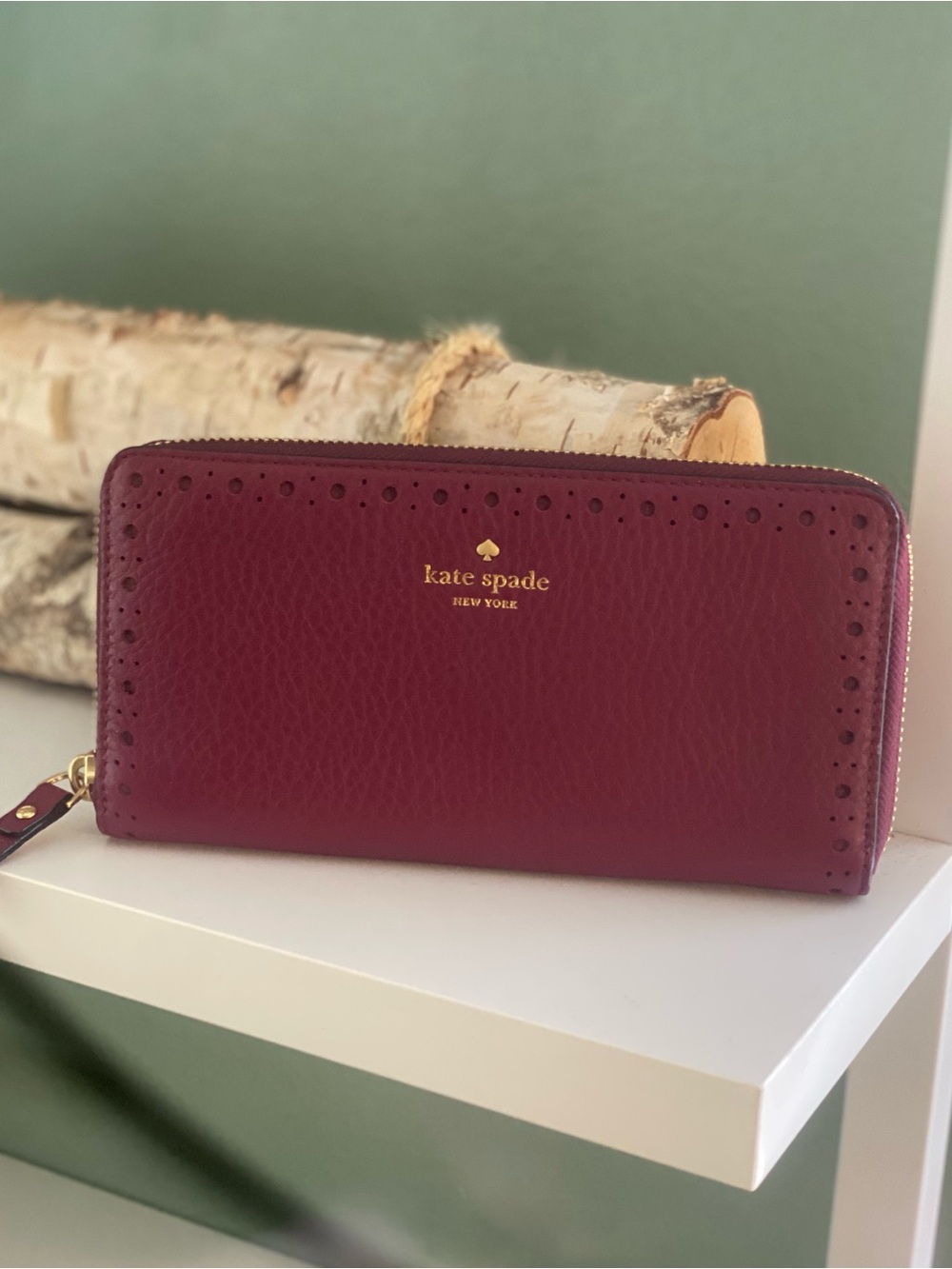 kate spade New York Burgundy Perforated Leather Zip Wallet with Gold Logo